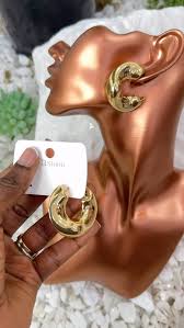 pair of gold-plated chunky hoop earrings.