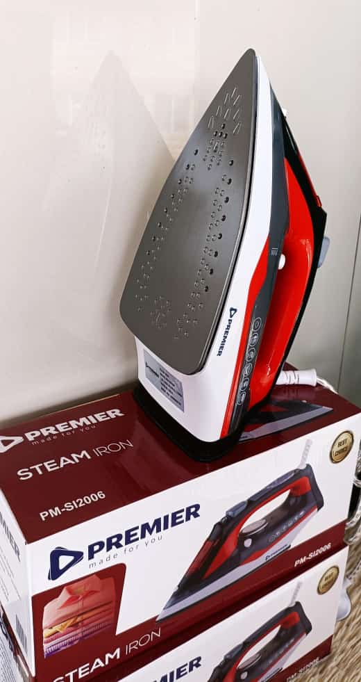 PREMIER STEAM IRON box. Non-stick soleplate: This prevents the iron from sticking to the fabric, making ironing easier and smoother. Adjustable temperature control to choose the right temperature