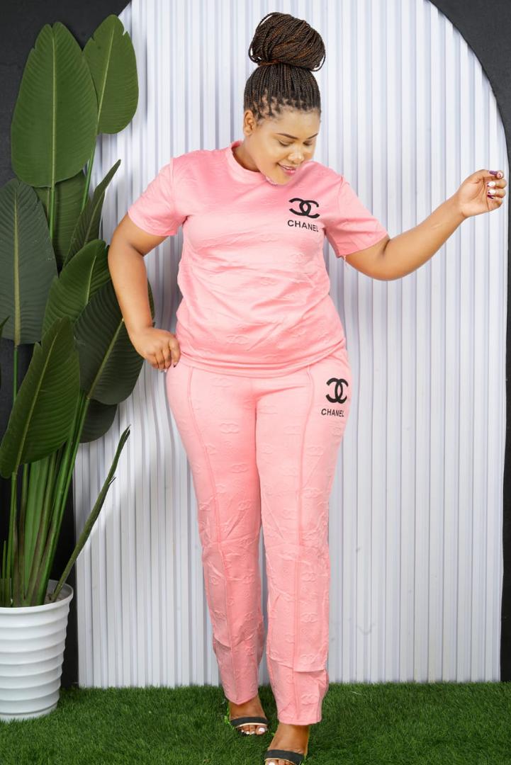"Luxuriously Tailored Full-Length Designer-Inspired Monogram Embossed Satin Cargo Jumpsuit Featuring Elegant Short Sleeves, High-Cinched Waist, and Functional Utility Pockets