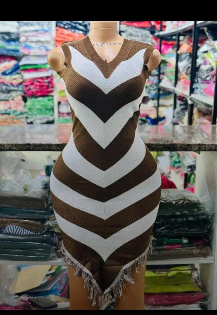 The Allure Curve-Defining Chevron Muse Bodycon Mini Dress Collection – Sleeveless V-Neck Sculpting Knit Dress with Bold Zigzag Stripe Illusion and Playful Fringe Hem Detailing