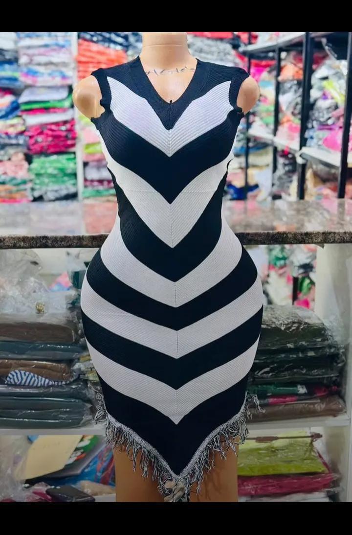 The Allure Curve-Defining Chevron Muse Bodycon Mini Dress Collection – Sleeveless V-Neck Sculpting Knit Dress with Bold Zigzag Stripe Illusion and Playful Fringe Hem Detailing