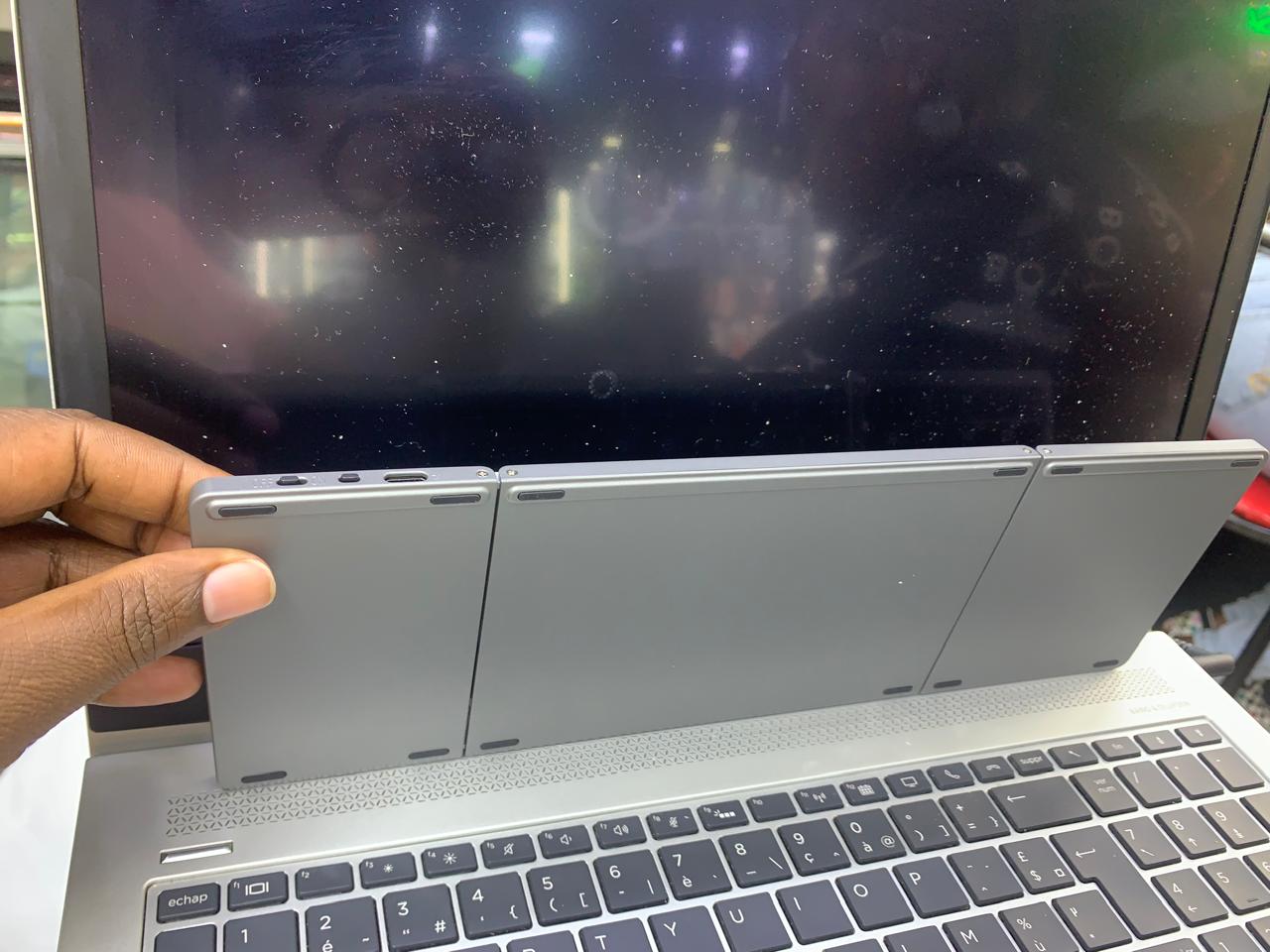 COMPACT FOLD-ABLE KEYBOARD RECHARGEABLE WITH TRACK-PAD USABLE WITH SMART DEVICES