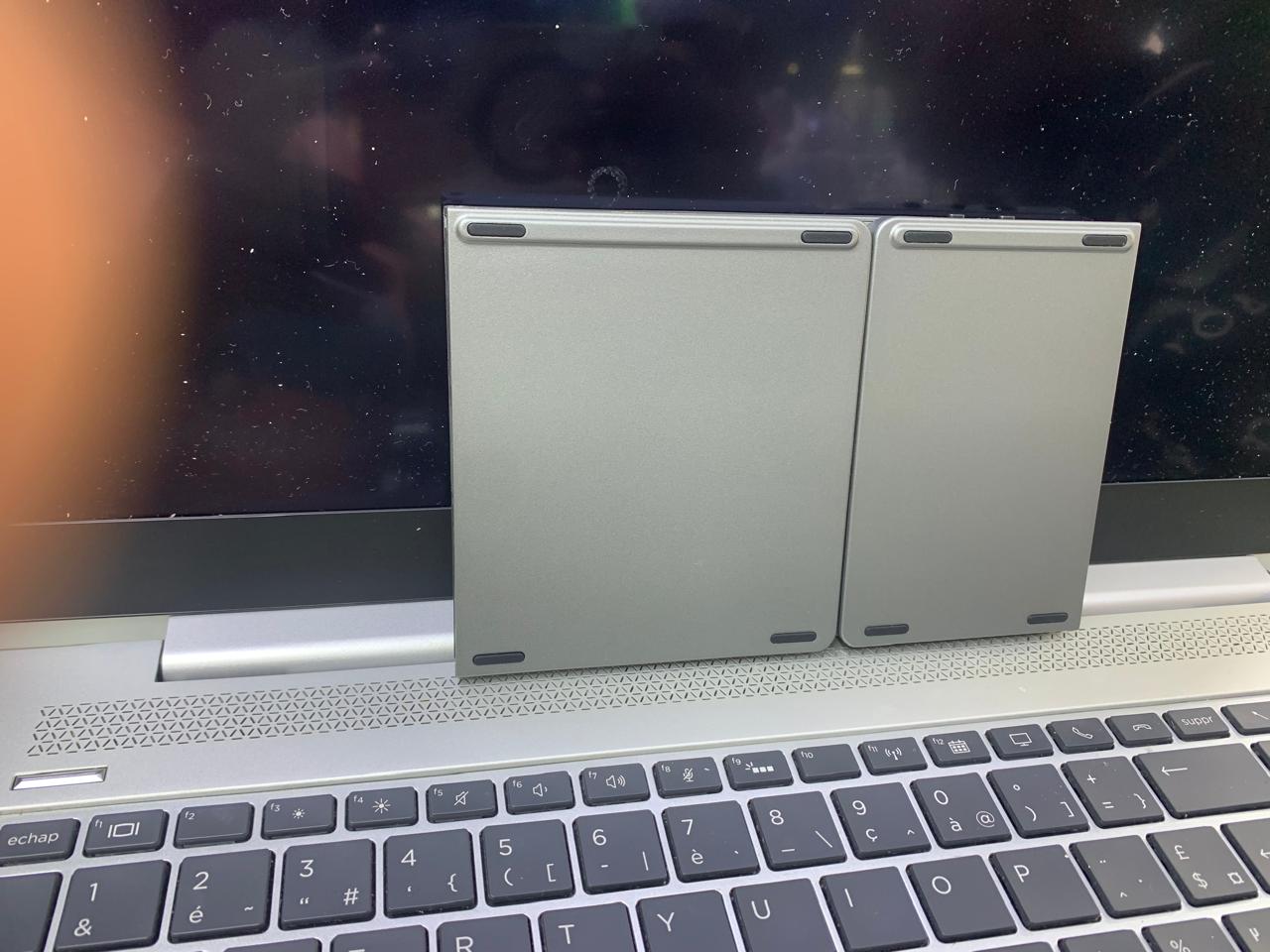 COMPACT FOLD-ABLE KEYBOARD RECHARGEABLE WITH TRACK-PAD USABLE WITH SMART DEVICES