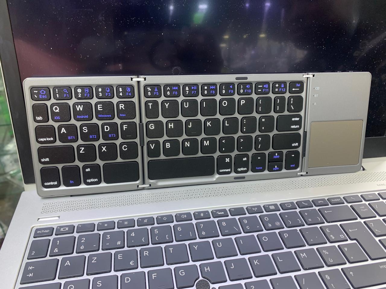 COMPACT FOLD-ABLE KEYBOARD RECHARGEABLE WITH TRACK-PAD USABLE WITH SMART DEVICES