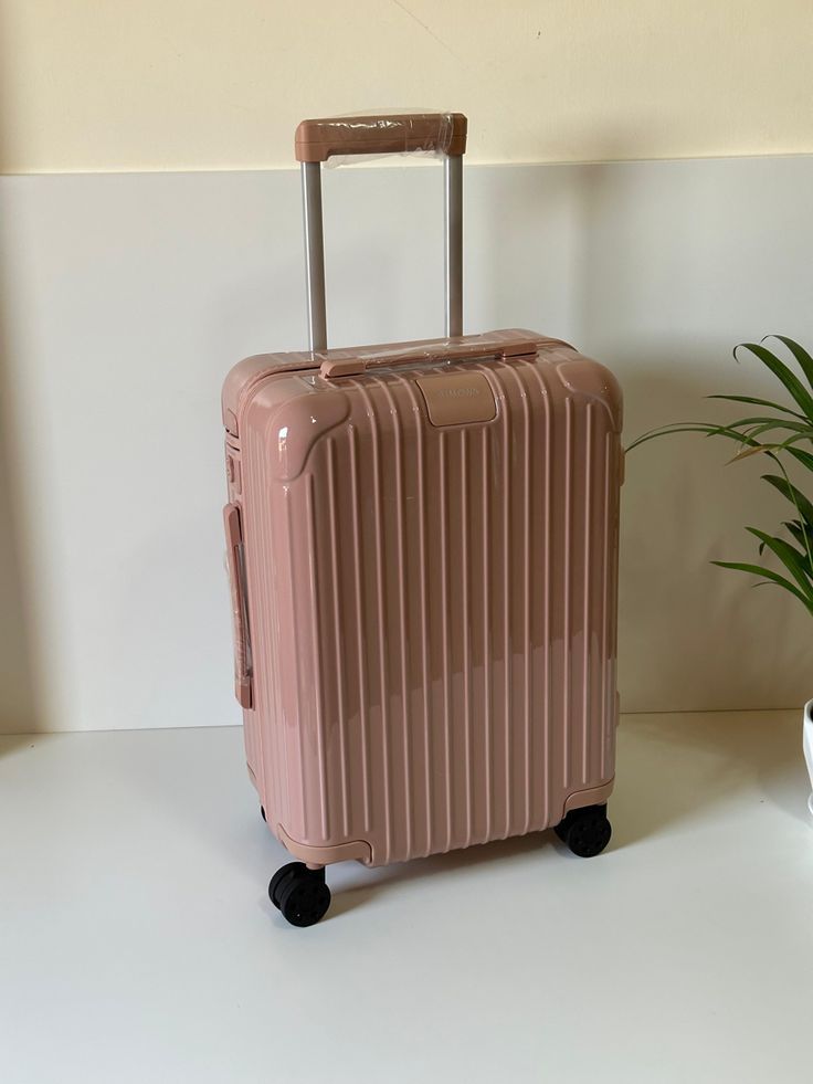 SUITCASE - RUBBER UNBREAKABLE PEACH PINK LARGE SUITCASE LUXURIOUS HIGH QUALITY.  Made of durable Polypropylene material. Lightweight and easy to transport.