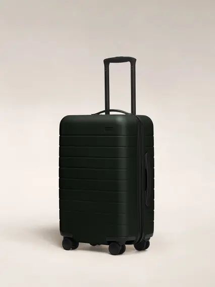 SUITCASE -  BLACK MEDIUM 20KG RUBBER UNBREAKBLE ANTISCRATCH TRAVEL BAG.