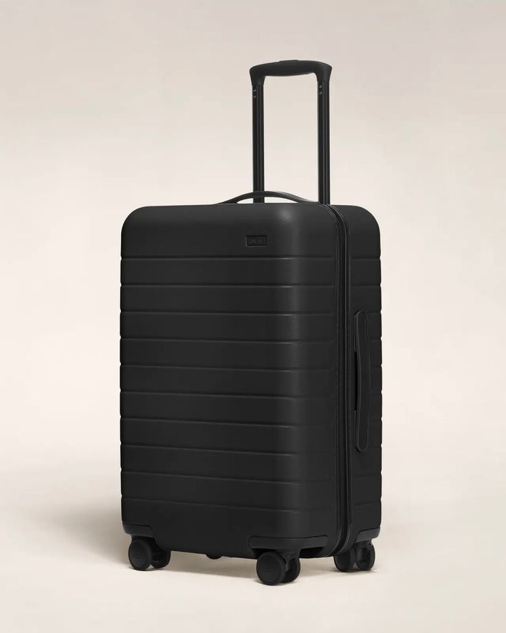 SUITCASE -  BLACK MEDIUM 20KG RUBBER UNBREAKBLE ANTISCRATCH TRAVEL BAG.