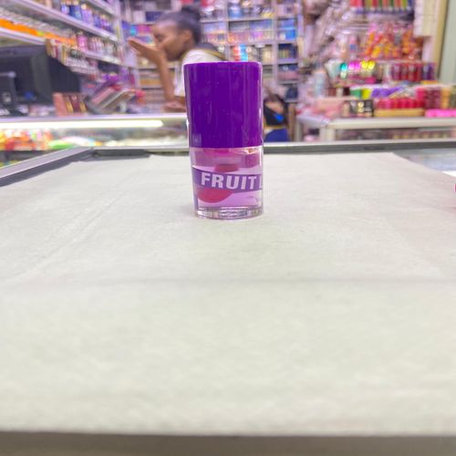 Kiss Beauty Fruit Lip Oil with a stunning pink tint. Indulge your lips. Experience nourishing hydration and a beautiful, vibrant finish that enhances your natural beauty! view 5