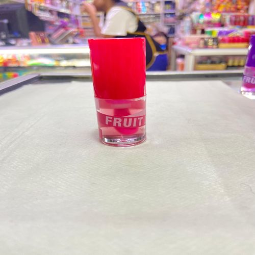 Kiss Beauty Fruit Lip Oil with a stunning pink tint. Indulge your lips. Experience nourishing hydration and a beautiful, vibrant finish that enhances your natural beauty! view 6