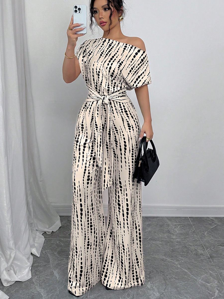 New summer women's jumpsuit refined elegance with an off-shoulder design and striped print. elastic waistband and tailored long pants, perfect for daily commuting, travel, dates, and photo shoots.