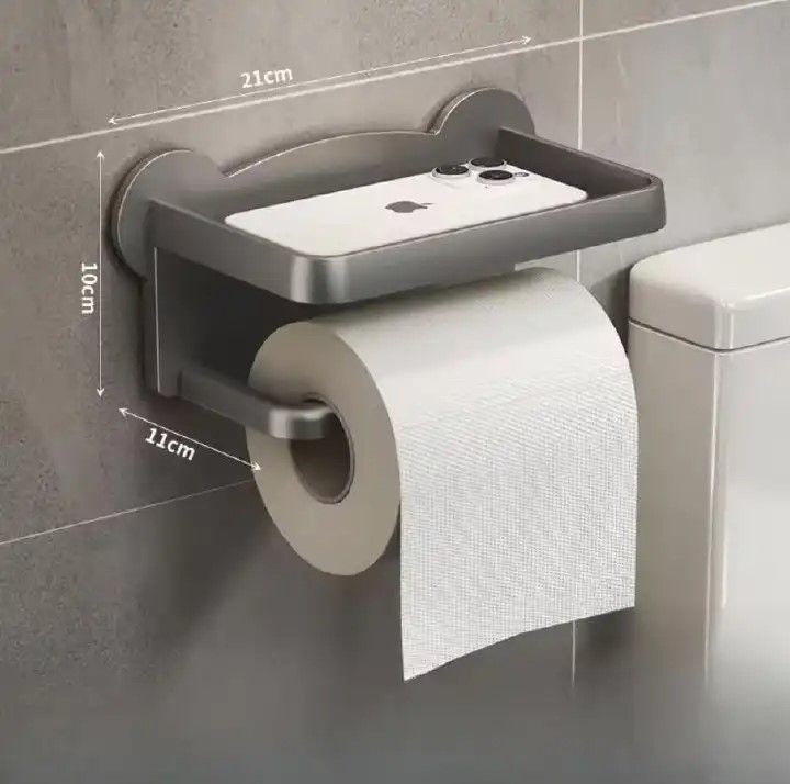 Punch-Free Toilet Tissue Holder – Wall-Mounted Paper Roll Dispenser (Grey, Black, White).▪️ No drilling required – mounts easily with strong adhesive tape ▪️ Protects walls and tiles from unnecessary