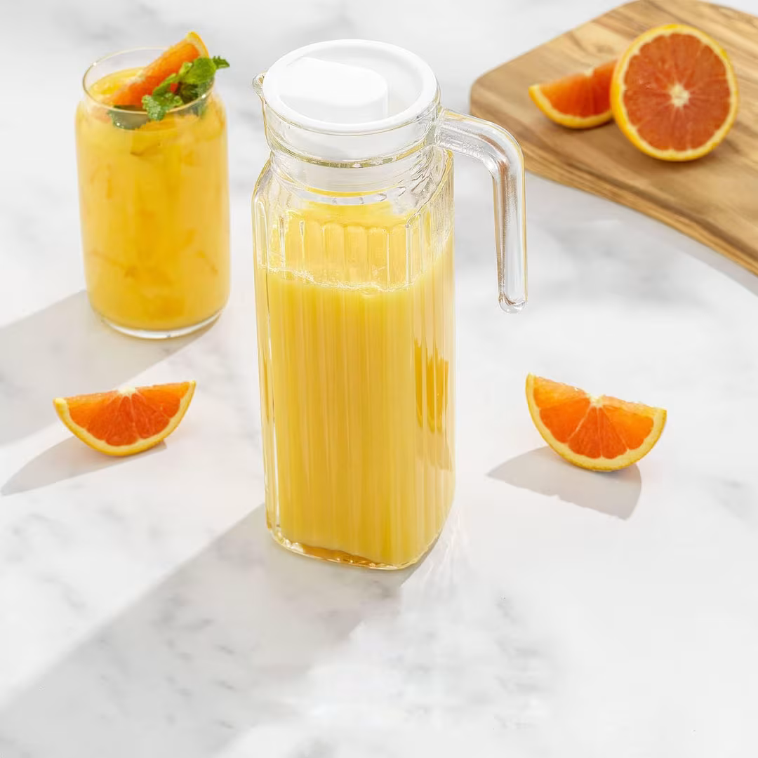 1 pc 1200ml Quadro Glass Fridge Jug. A classic and functional pitcher perfect for water, juice, iced tea, or milk. Designed for both aesthetics and convenience, this jug fits neatly in the fridge.