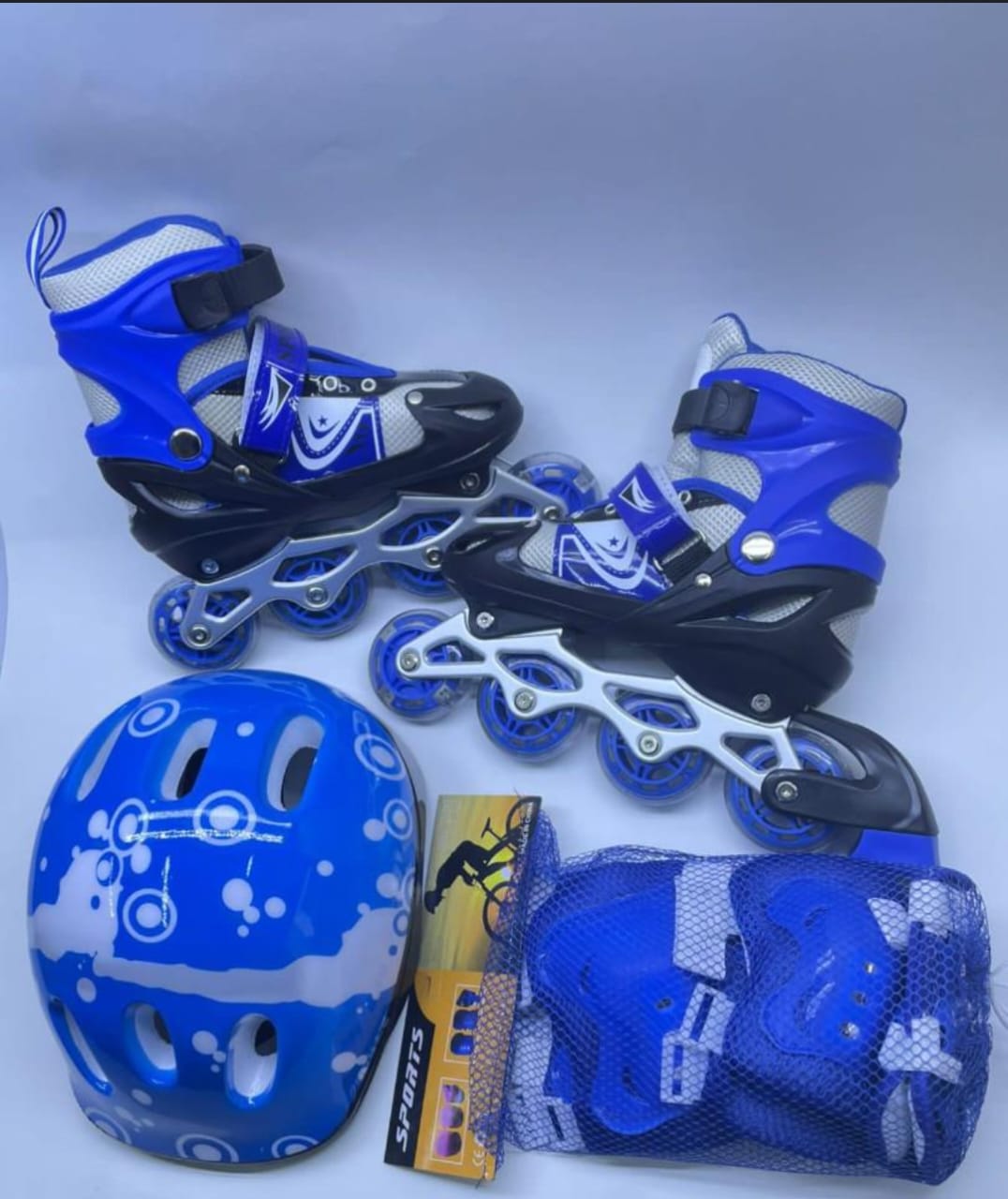 35-38 size medium KIDS ADJUSTABLE SKATING SHOES HELMET KIDS AND THREE PAIRS OF PROTECTIVE SAFETY GEARS adjustable