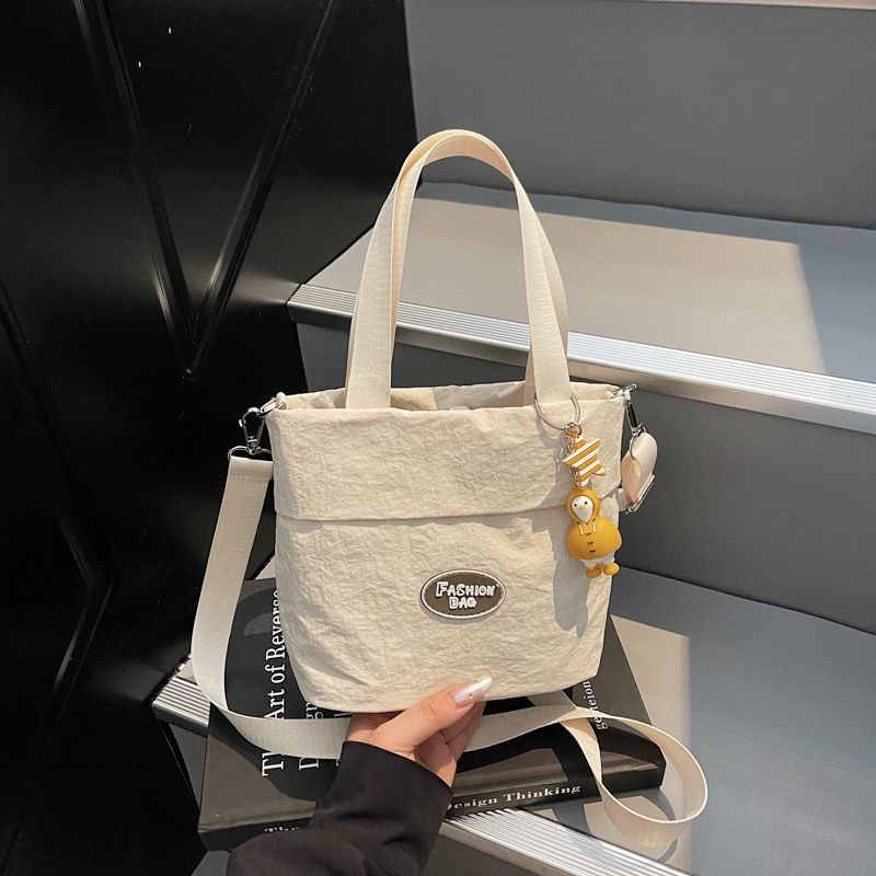 Stylish women's shoulder bags 2025 Large capacity student tote bag New canvas commuter handbag Women's eco-bag Cute canvas bag Women's handbag shoulder bag Japanese Harajuku crossbody bag Girls' small