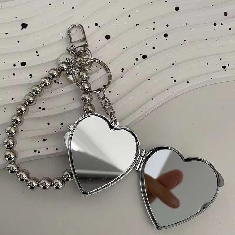 Fashionable metal bead shaped keychain, women's sweet mirror bag pendant keychain, bag hanging chain, mini heart-shaped double-sided makeup mirror pendant, creative and personalized keychain