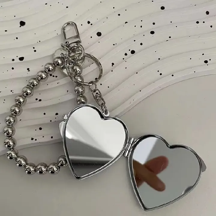 Fashionable metal bead shaped keychain, women's sweet mirror bag pendant keychain, bag hanging chain, mini heart-shaped double-sided makeup mirror pendant, creative and personalized keychain