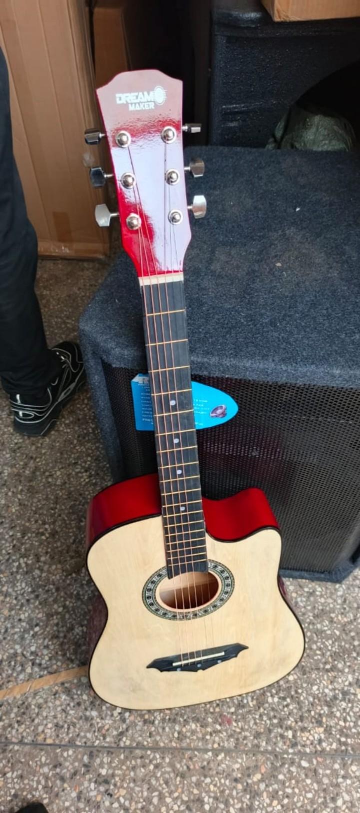 Semi-Acoustics guitars 38" plus Guitar pick, Bag and a Shoulder strap.