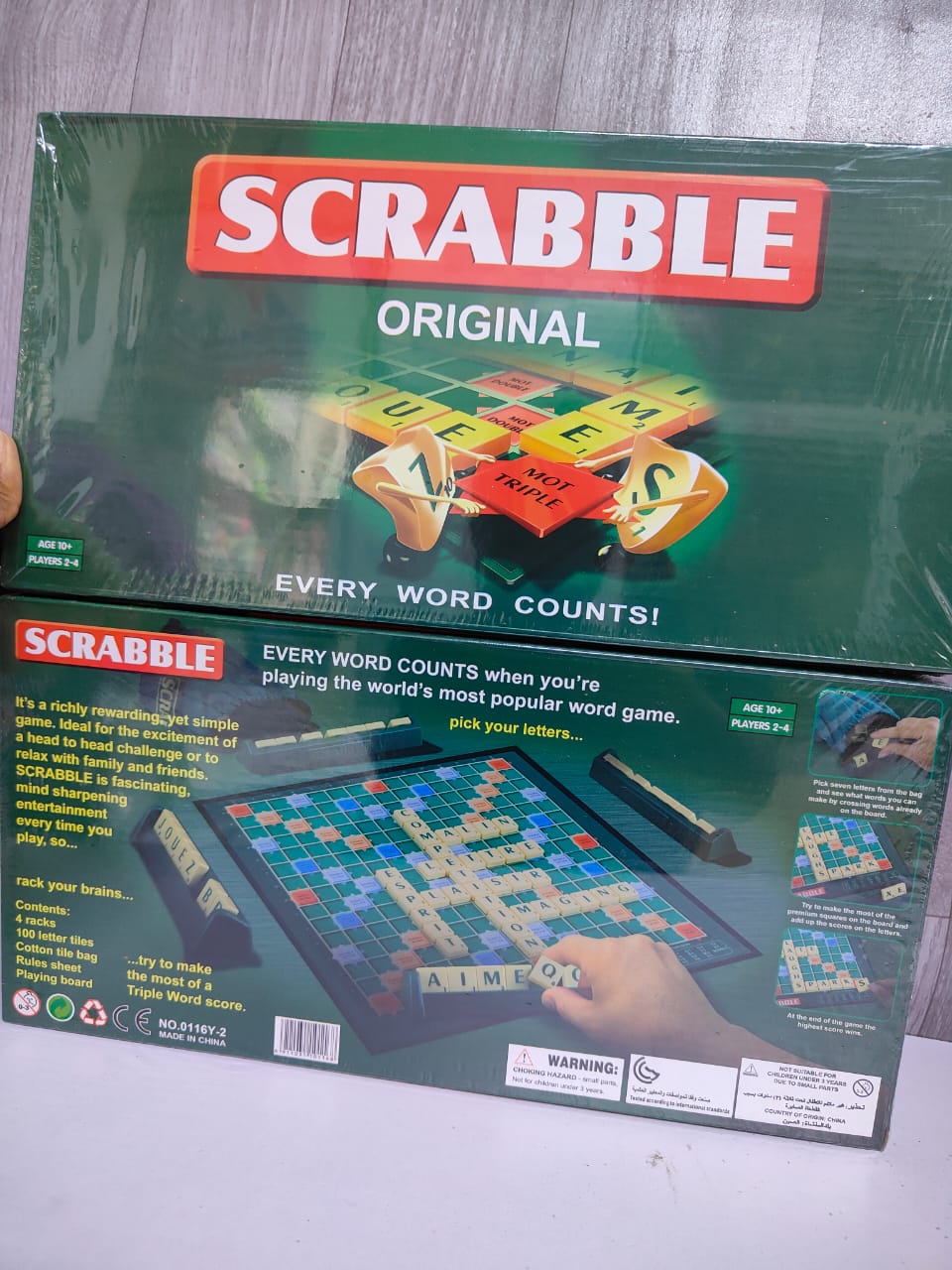 Scrabble game .The objective of the game is to compete for the highest score by forming interlocking words in a cross-word fashion on the Scrabble board using tiles displaying letters.