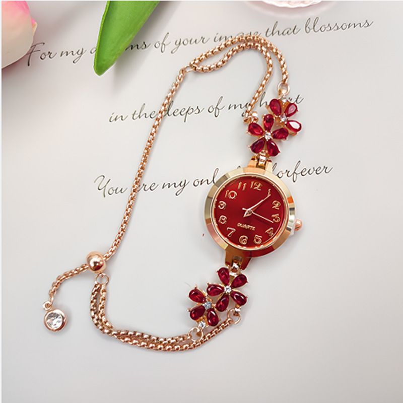 New women's niche fashion diamond inlaid watch flower shaped digital women's watch female model student pull-out bracelet watch