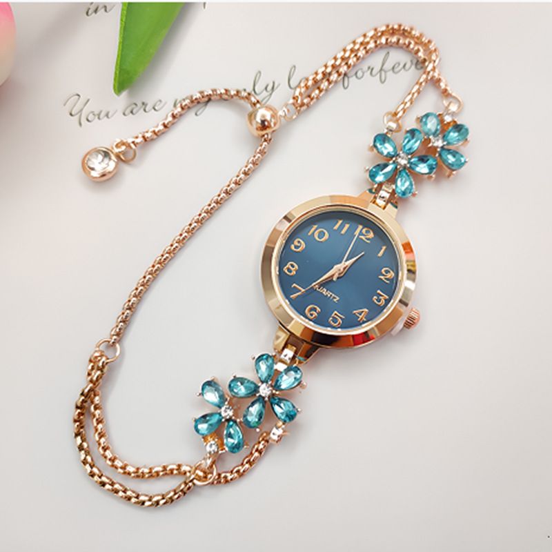 New women's niche fashion diamond inlaid watch flower shaped digital women's watch female model student pull-out bracelet watch