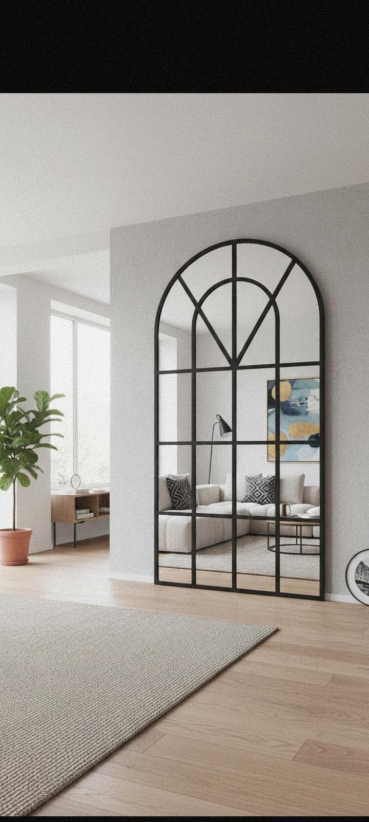 Arched cathedral window full-length mirror-black frame.