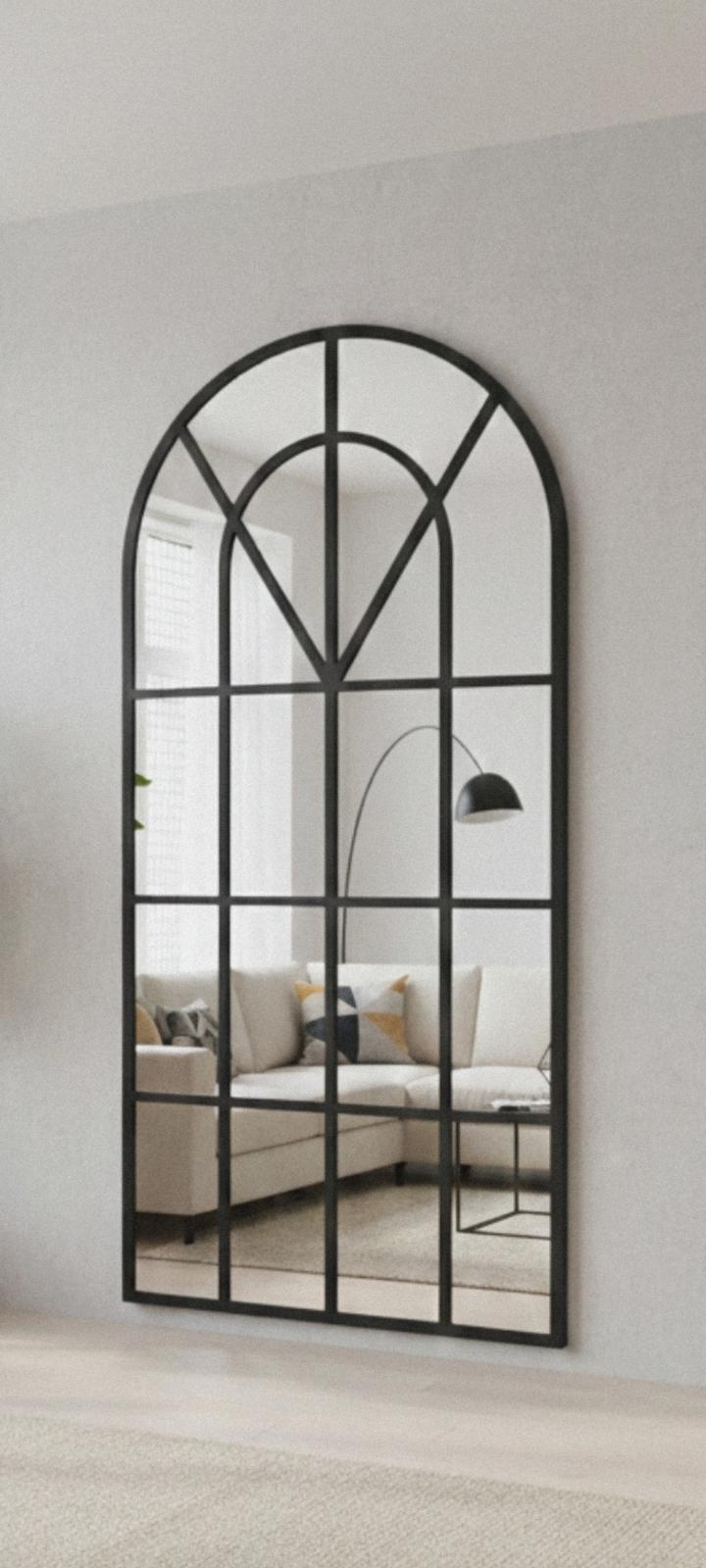 Arched cathedral window full-length mirror-black frame.