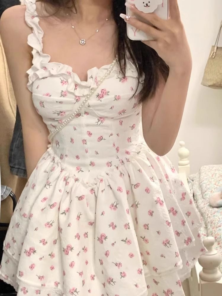 French white floral suspender dress for women's summer new style spicy girl pure desire wind, waist cinching and slimming princess fluffy skirt