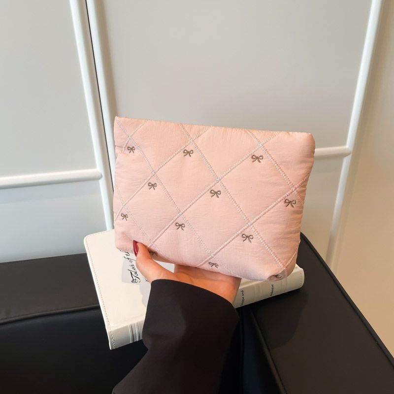 Butterfly knot pattern is fashionable and versatile. Quilted embroidery thread grid filled cotton makeup bag, casual hand-held bag, warm down small bag, inner bag, wash bag, pen bag, travel bag