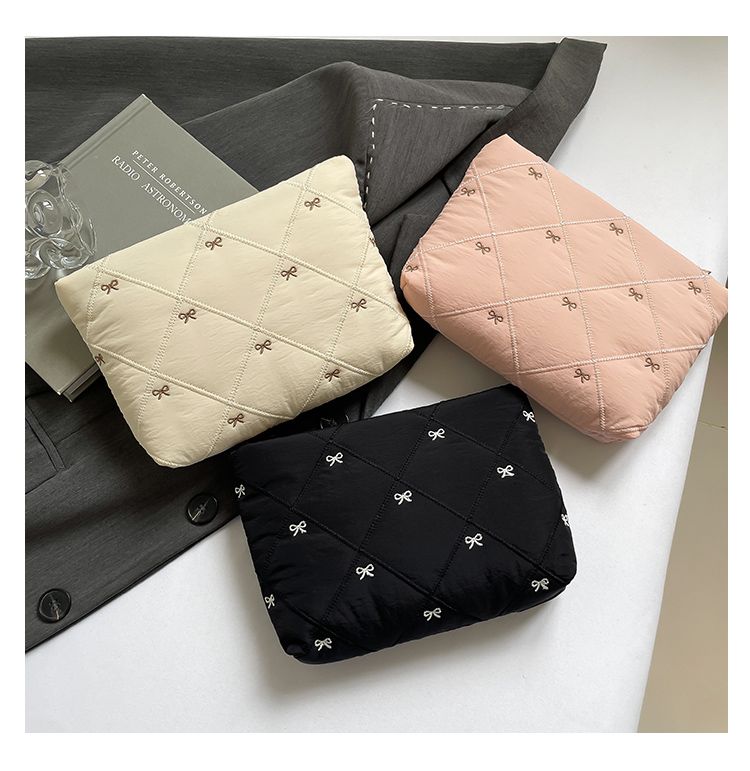 Butterfly knot pattern is fashionable and versatile. Quilted embroidery thread grid filled cotton makeup bag, casual hand-held bag, warm down small bag, inner bag, wash bag, pen bag, travel bag