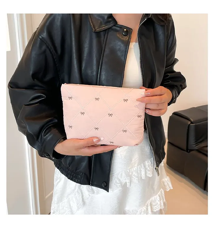 Butterfly knot pattern is fashionable and versatile. Quilted embroidery thread grid filled cotton makeup bag, casual hand-held bag, warm down small bag, inner bag, wash bag, pen bag, travel bag