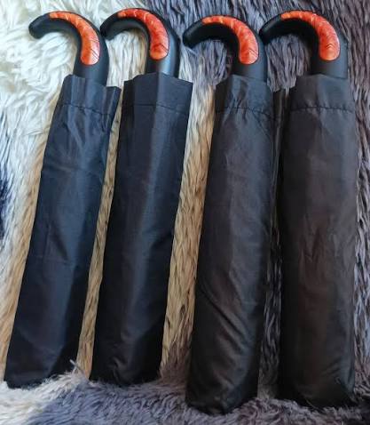 Strong Good Quality generic black foldable umbrella featuring curved handles and one-touch opening switches.