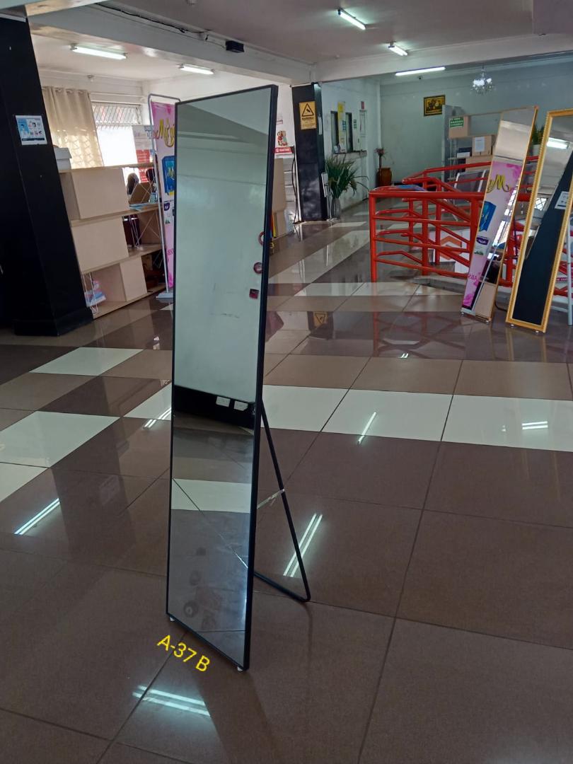 Full-Length Standing Mirror with Black Frame" or "Floor Mirror with Stand".