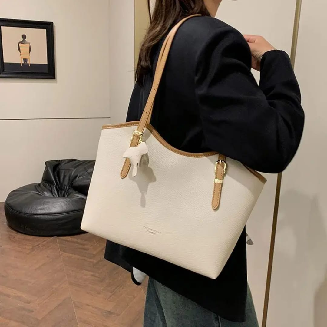 Nikki tote bag. Colors available in Black, Brown, Beige and White. Spacious enough for your essentials, stylish enough to elevate any outfit.