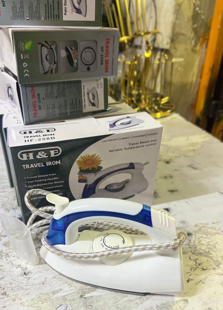H&F Travel Iron, model HF-258B.
This is a compact, portable steam iron designed for travel. Key features of this specific model include:
Design: It has a flat folding handle for easy packing and stora