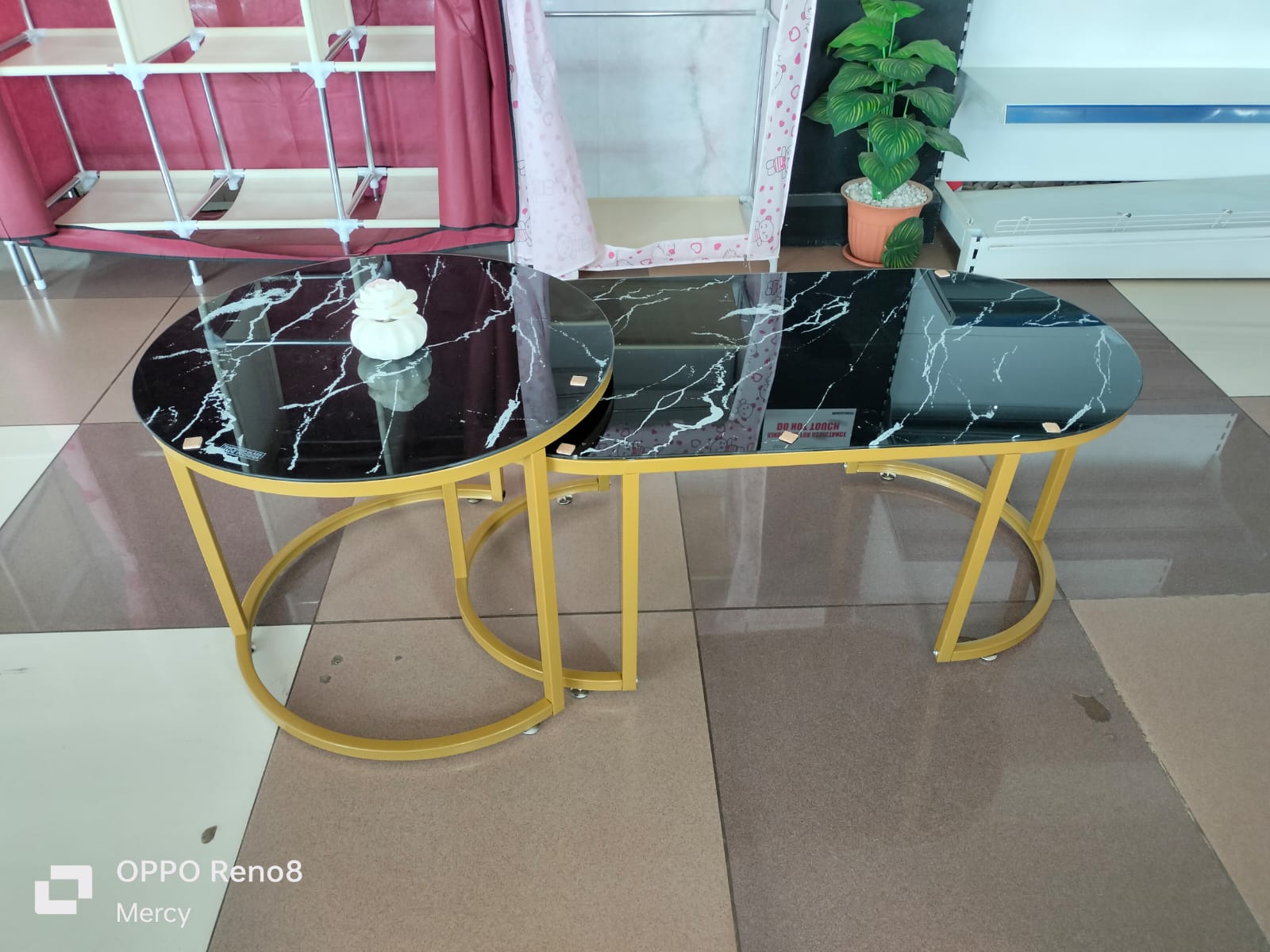 nesting coffee tables.
This type of furniture consists of two or more tables of varying sizes that are designed to fit together, allowing the smaller table to be stored under the larger one when not i