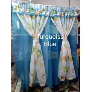 kitchen curtain. It appears to be a sheer curtain with a pineapple pattern. The curtain is tied back to let in light.