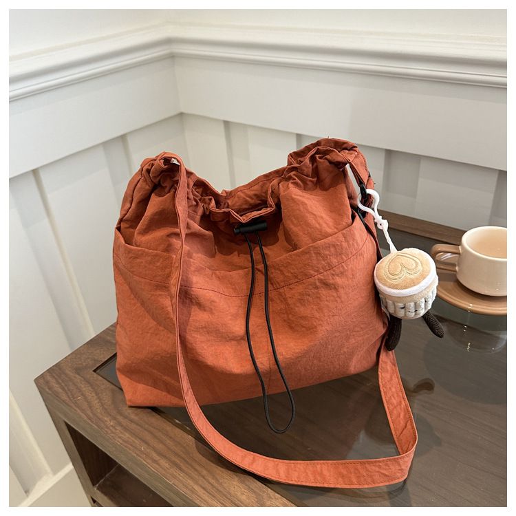2025 new large capacity waterproof nylon fabric drawstring pleated shoulder bag for travel and leisure, crossbody bucket bag black No accessories
