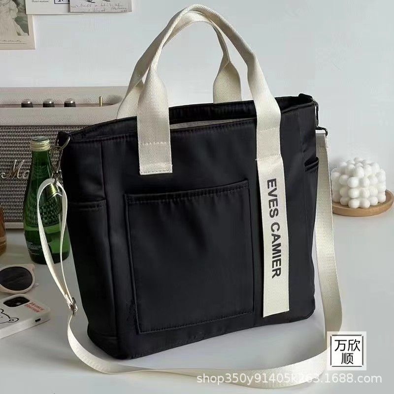 Original Design Waterproof and Stylish Tote Canvas Handheld Crossbody Bag Simple and Versatile One Shoulder Handheld Bento Meal Box Bag black AS PICTURE
