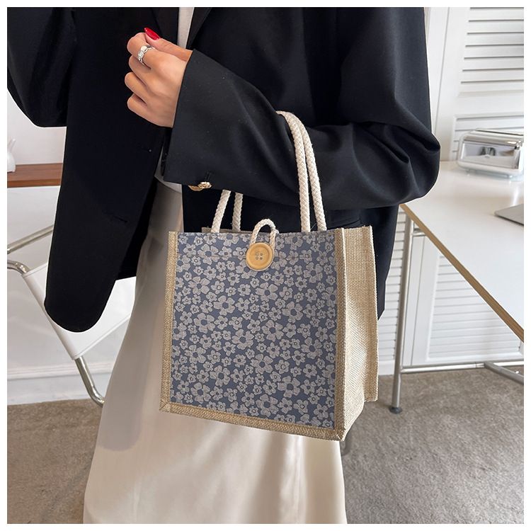 A trendy woman carrying a linen bag to work looks stylish. When she goes out, she carries a lunch bag and a small shoulder bag
