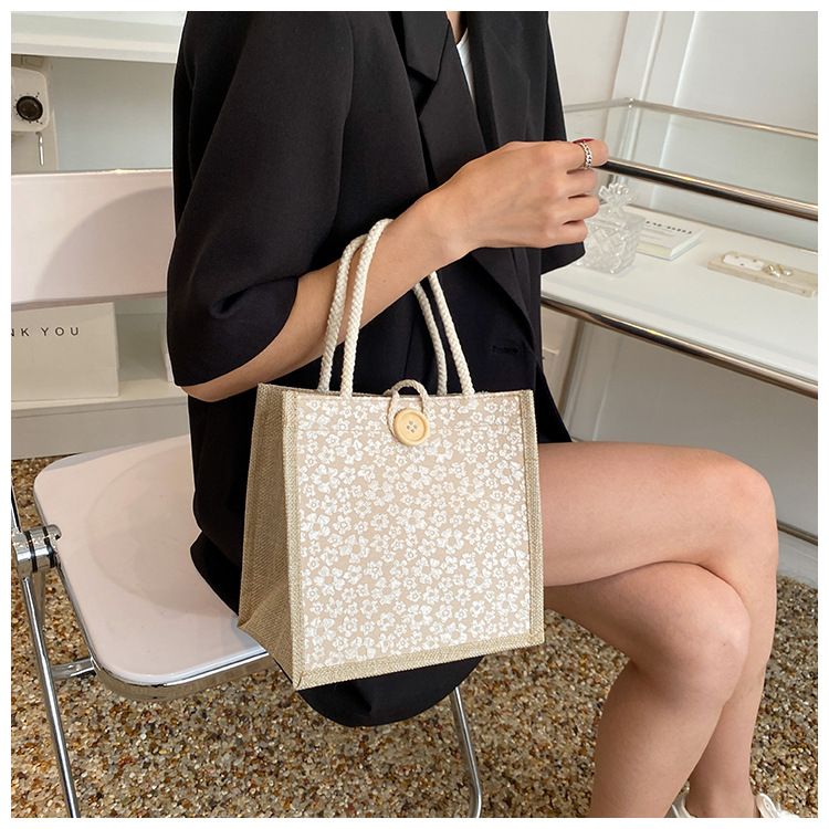A trendy woman carrying a linen bag to work looks stylish. When she goes out, she carries a lunch bag and a small shoulder bag