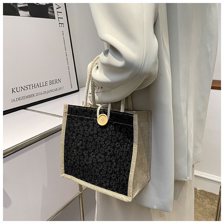 A trendy woman carrying a linen bag to work looks stylish. When she goes out, she carries a lunch bag and a small shoulder bag