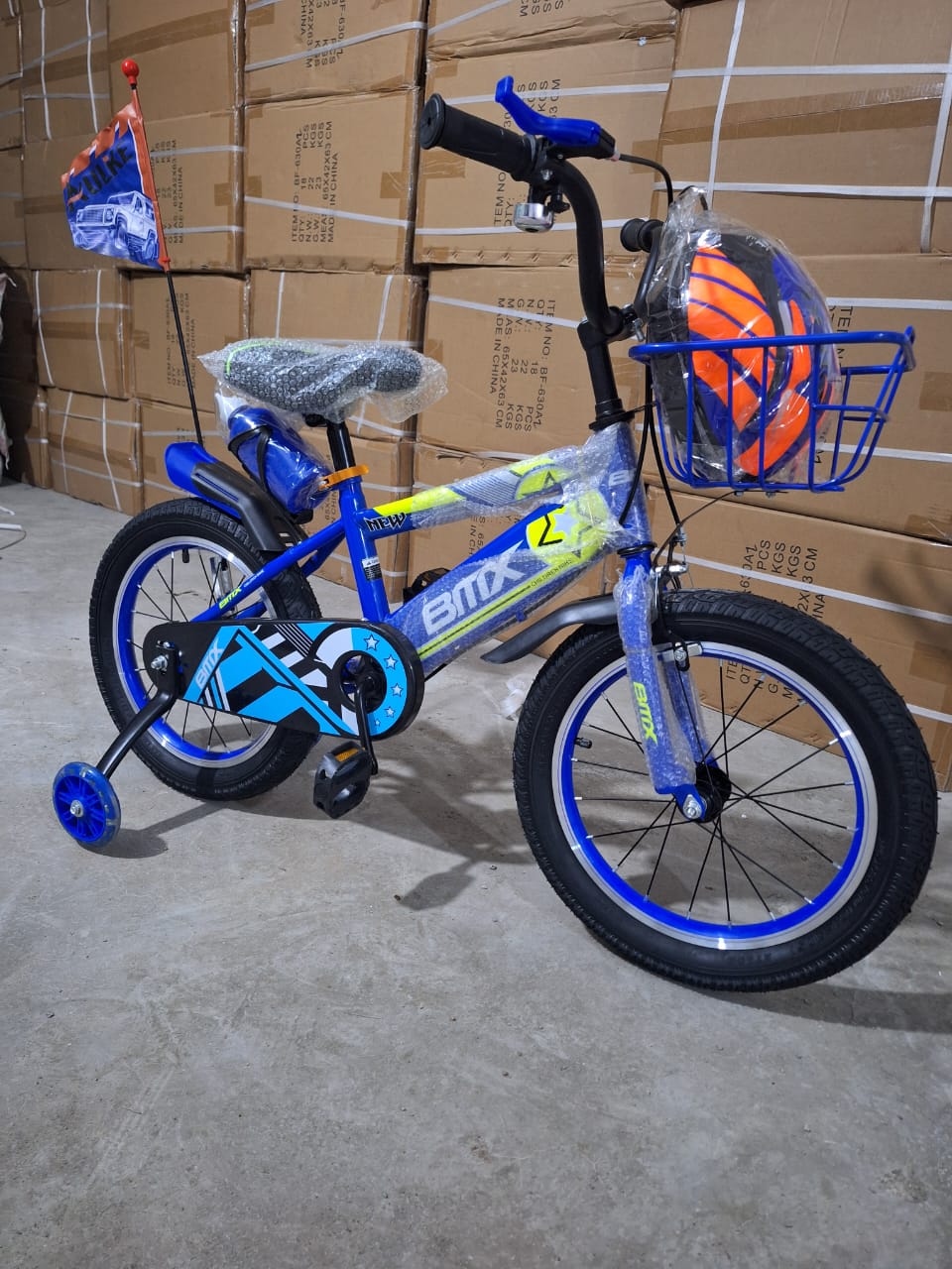 BMX size 16 kids' bicycle with removable training wheels and free helmet Durable steel frame for easy maneuverability.
