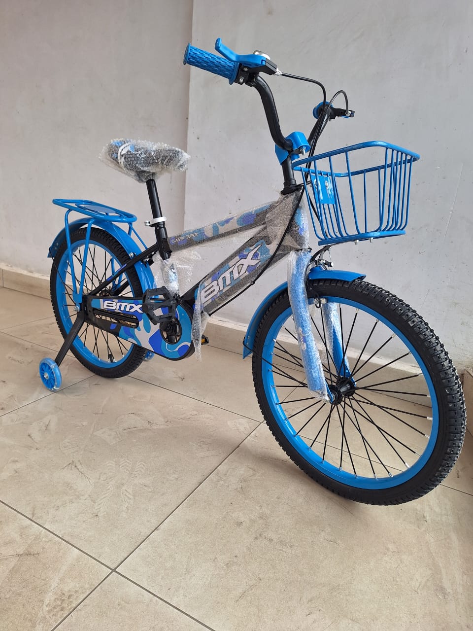 size 20 kids' BMX bicycle with removable training wheels Durable steel frame for easy maneuverability.