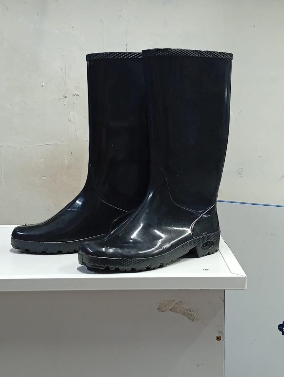 Black gumboots waterproof footwear designed to keep feet and legs dry and protected, featuring a cleated rubber outsole for enhanced grip on slippery surfaces.
Men's Shoes > Boots > Mid-Calf