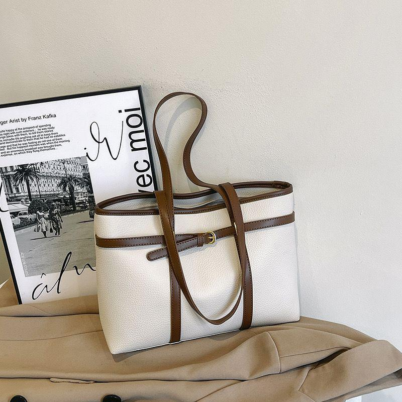 TZ  fashionable  bags. Available in black, brown, cream and beige. Classy simple and elegant with multiple compartments