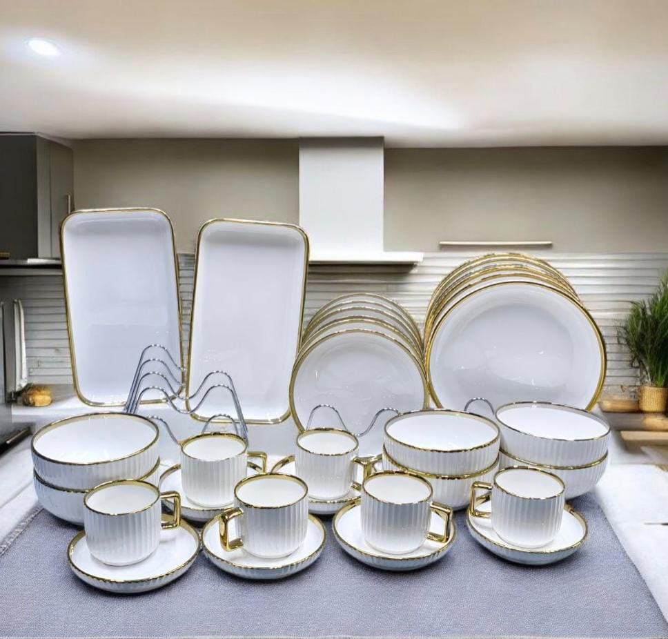 32 pieces White and Gold  porcelain dinner set with ribbed texture 
✔️6 pcs dinner plates 10’inch.
✔️6pcs side plates 8’inch.
✔️6pcs soup bowls 6’inch.
✔️6pcs tea cups 220ml.
✔️6 pcs cup saucers.