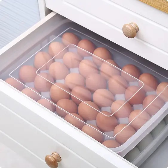 34-Egg Storage Container with Lid – Stackable Fridge Organizer. Keep your eggs fresh, safe, and organized! This large-capacity egg tray with a secure lid is designed to store up to 34 eggs neatly