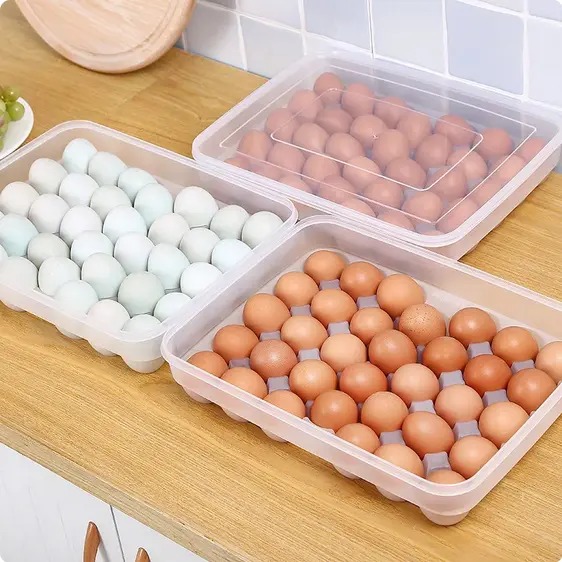 34-Egg Storage Container with Lid – Stackable Fridge Organizer. Keep your eggs fresh, safe, and organized! This large-capacity egg tray with a secure lid is designed to store up to 34 eggs neatly