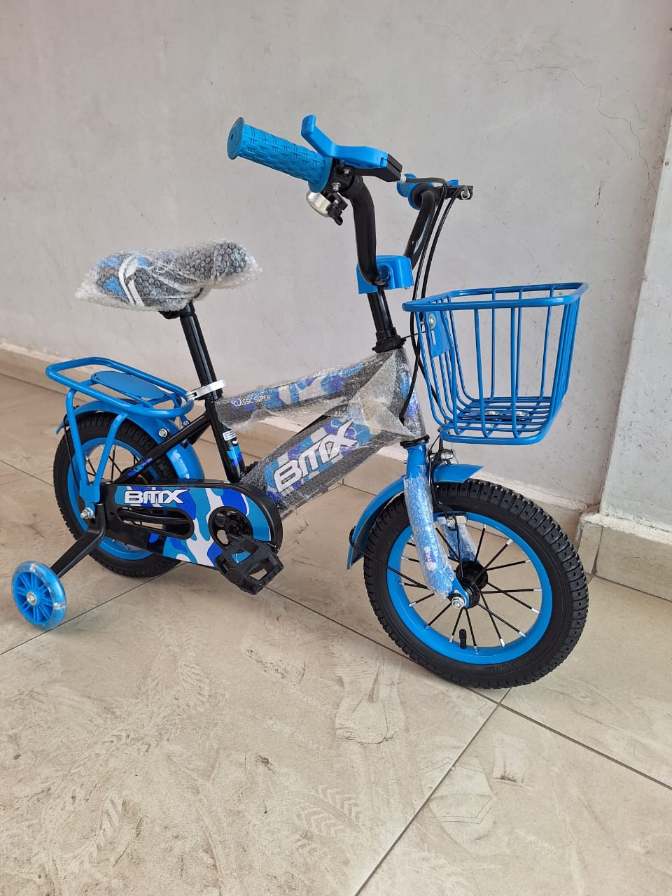 BMX-style children's bicycle. This specific model is typically a size 12, suitable for children aged 2 to 5 years old. 
It features a sturdy steel frame, a comfortable saddle with a quick-release mech