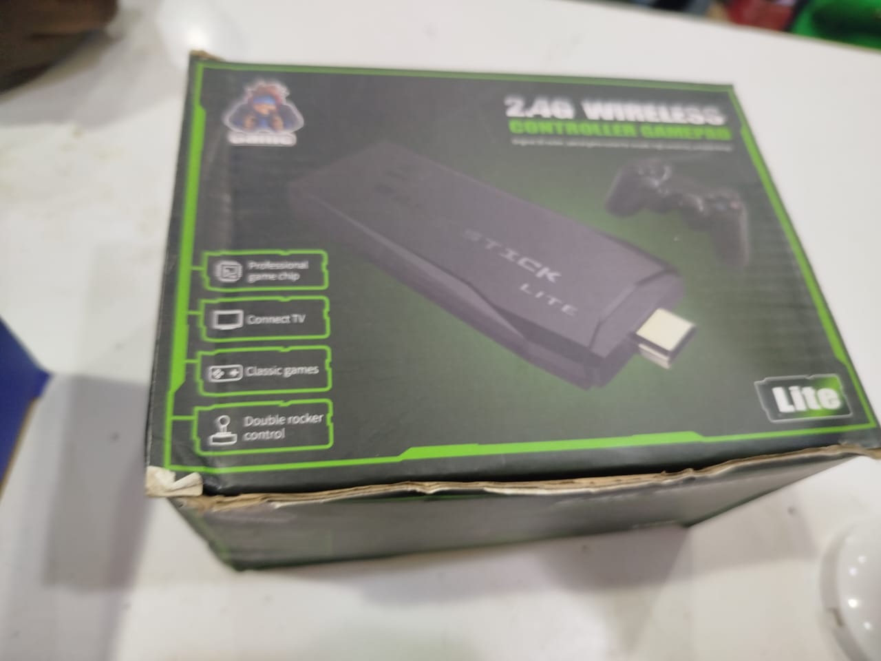 2.4G wireless controller and gamepad kit. It is a portable TV video game console designed for retro gaming. 
Key features of the Game Stick Lite include:
Wireless Connectivity: It uses 2.4G wireless c